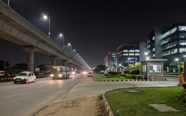 Call girls area Electronic City — elevated expressway and tech campus at night