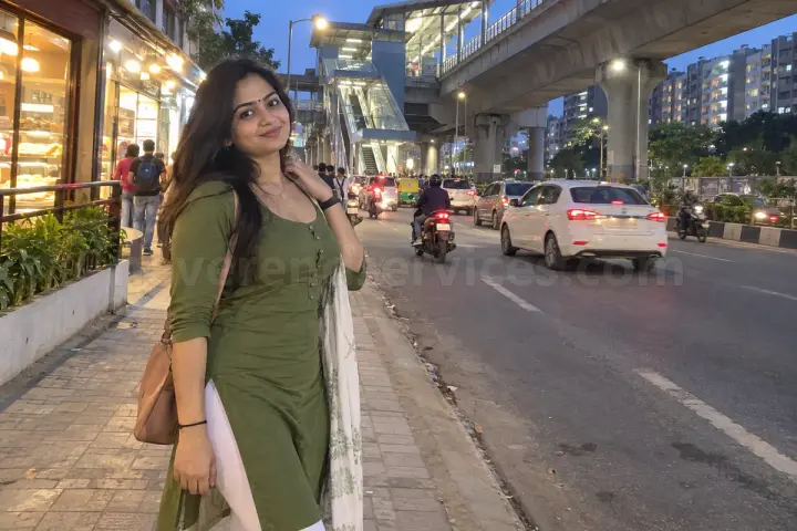Woman in a green kurti near a metro station on Kanakapura Road