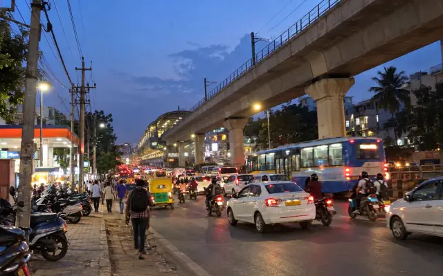 Hosur Road at Bommanahalli with metro pillars and evening traffic