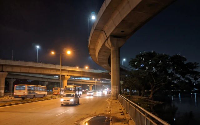 Call girls area Hebbal — flyover ramps and the lake at night